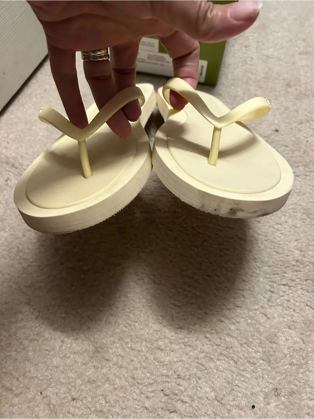 TORY BURCH KIRA padded flip flops in light yellow.